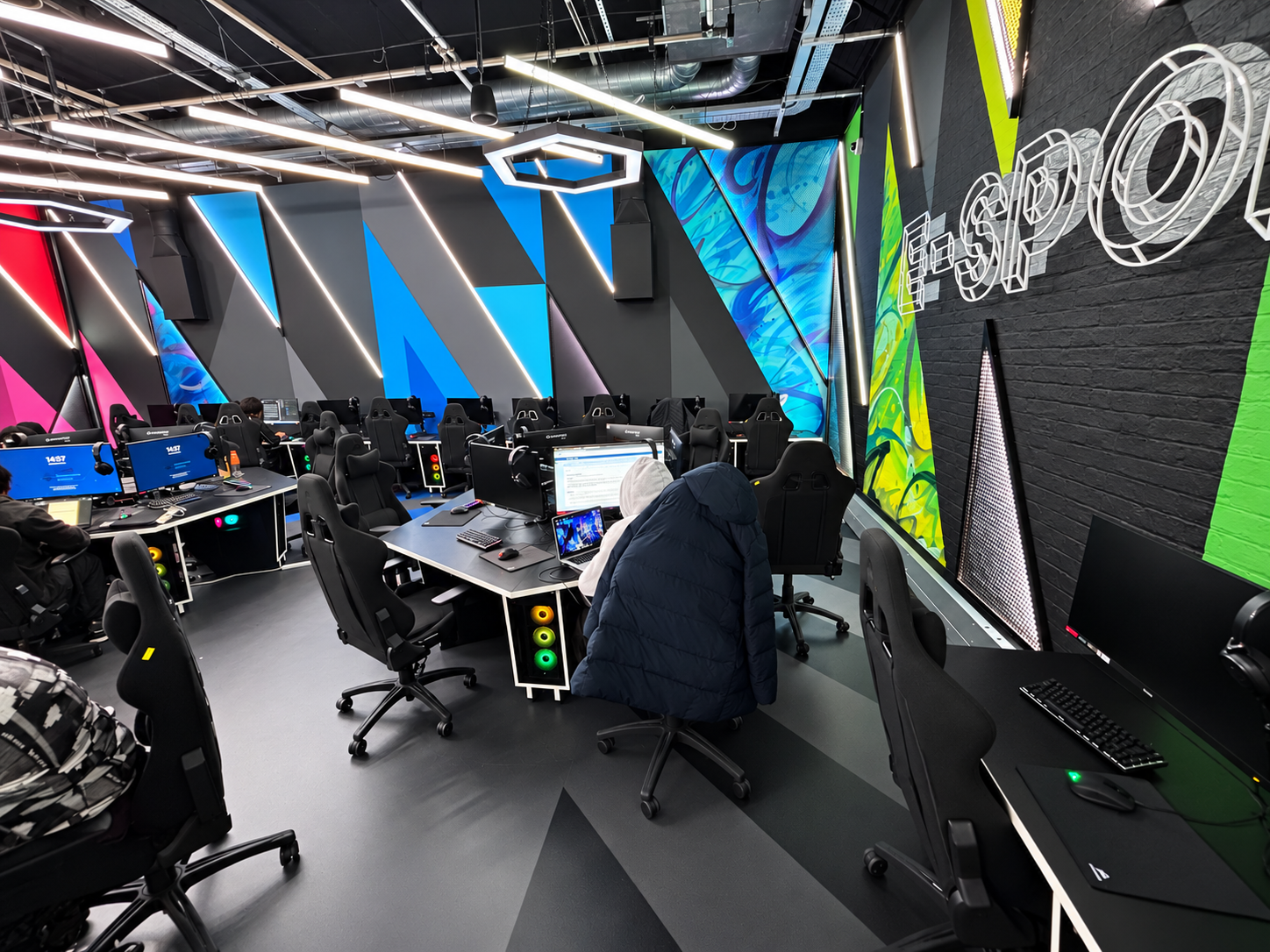 Gaming desk islands and wall-side PC workstations at St Mary’s University esports arena